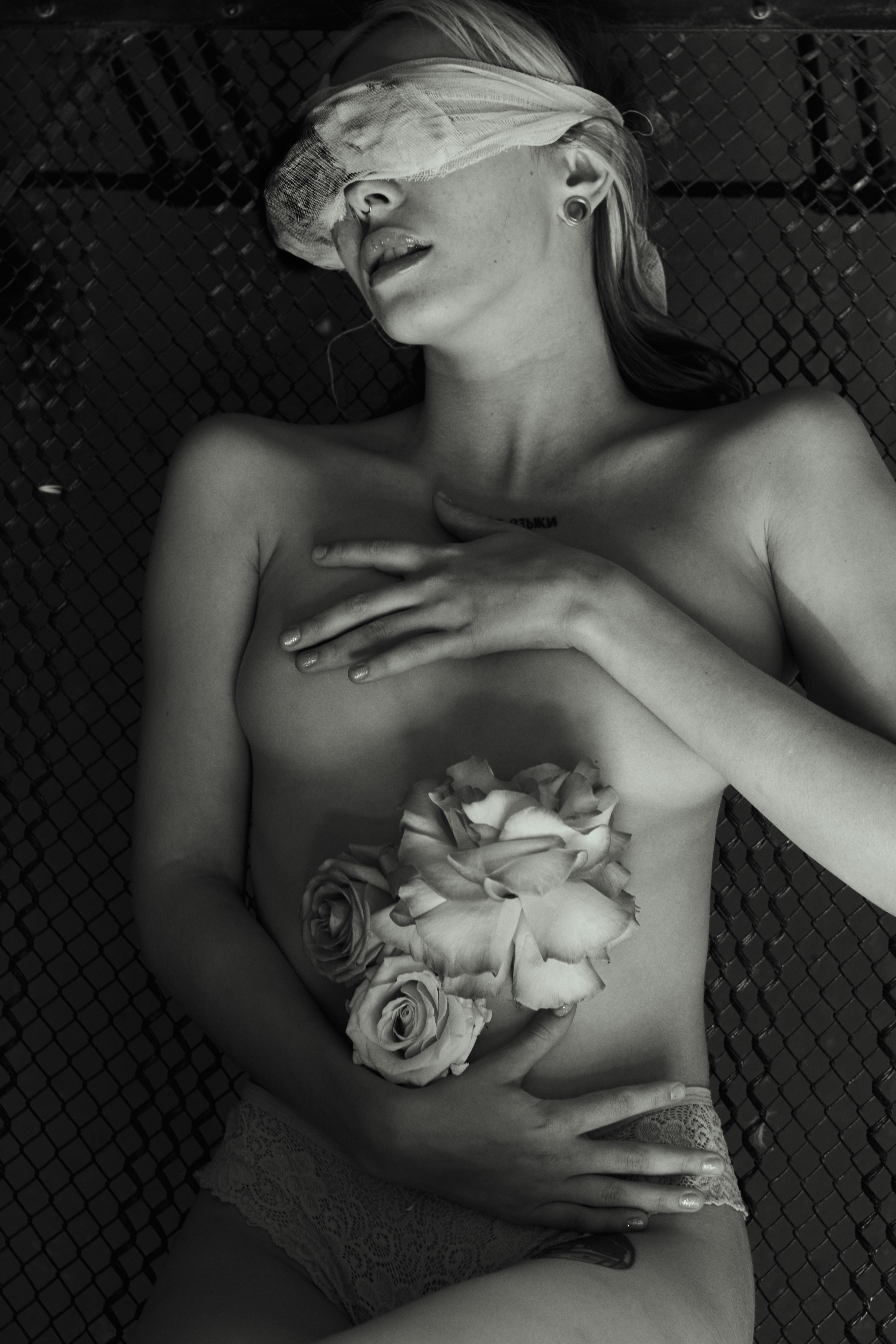 A Naked Woman Holding Flowers · Free Stock Photo