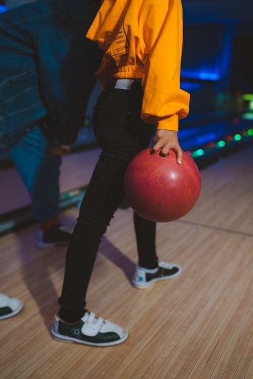 Free A Person Holding a Bowling Ball Stock Photo