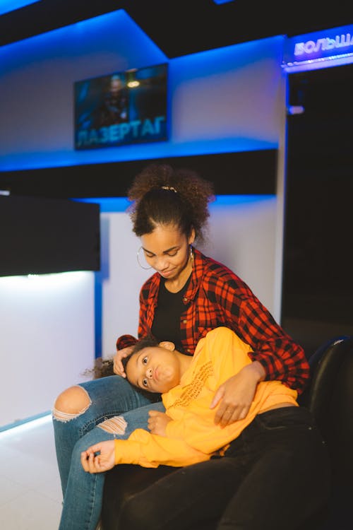 Girl Lying on the Lap of a Woman