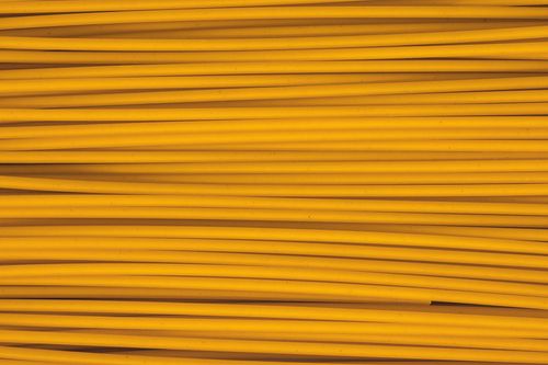 Free Close-up shot of uncooked yellow pasta spaghetti showcasing texture and pattern. Stock Photo