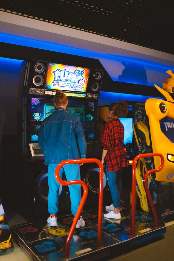 Children's entertainment business for sale - people playing games in an arcade