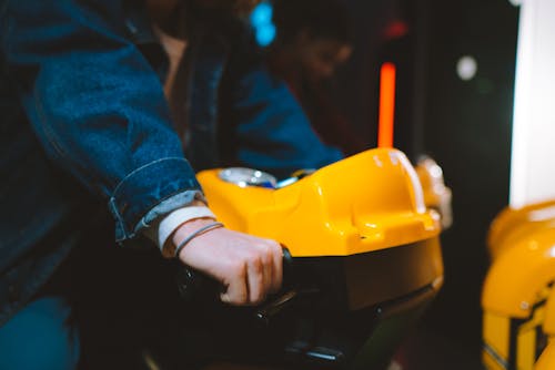 Person Playing an Arcade Game