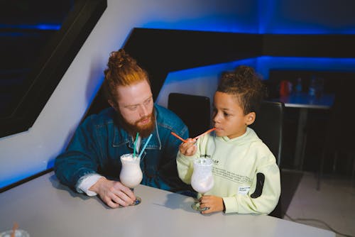 Man and a Boy Having Milkshake