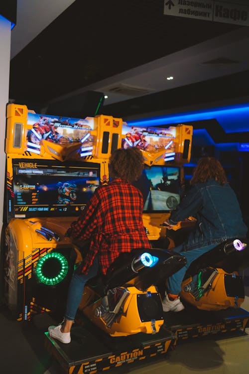 Two People Playing an Arcade Game