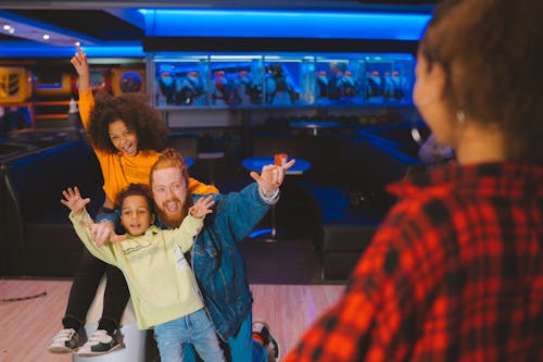 Father and Kids in a Amusement Center