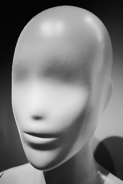 Free Close-up of a featureless mannequin head in grayscale, emphasizing the smooth texture. Stock Photo