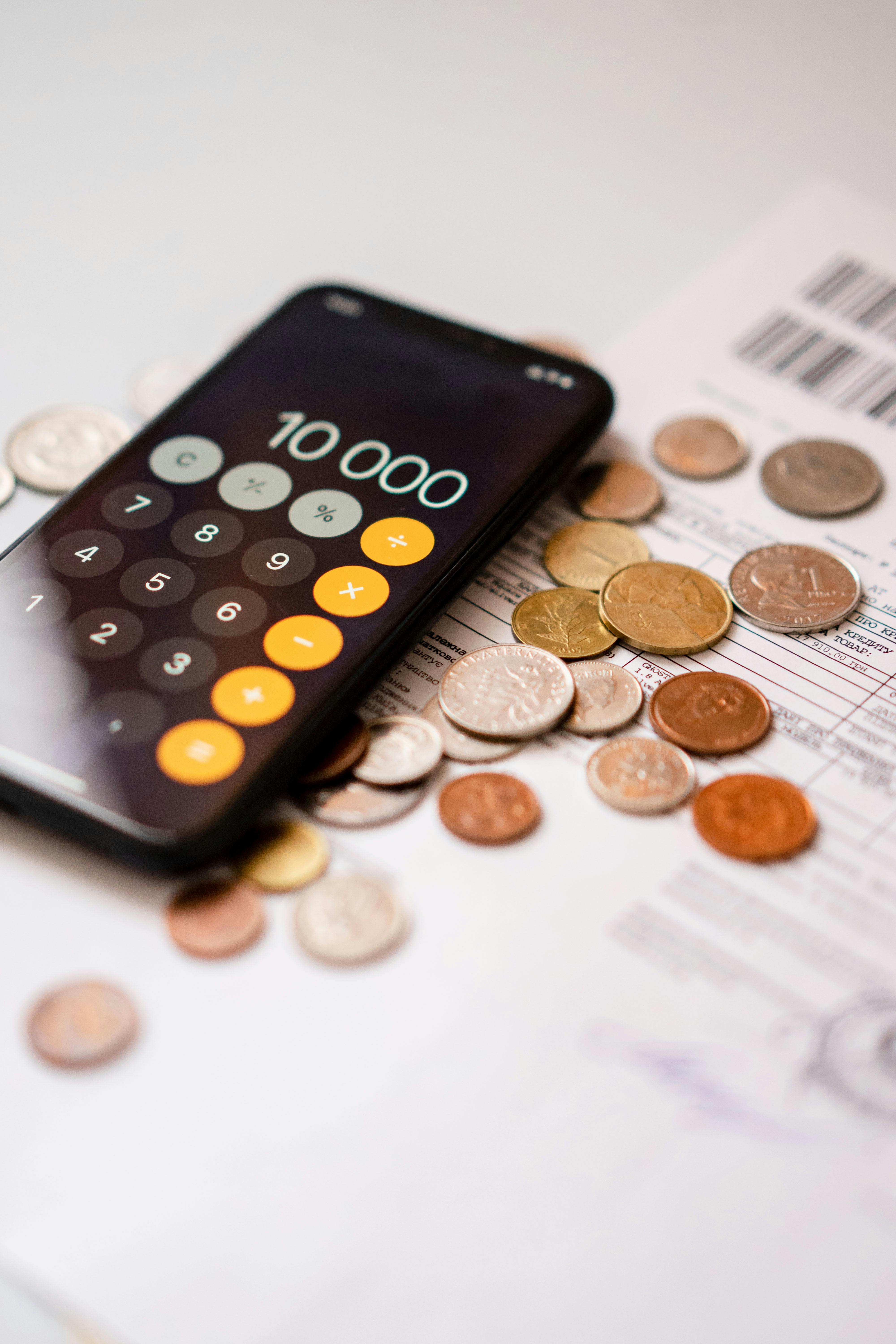 calculator on top of the coins