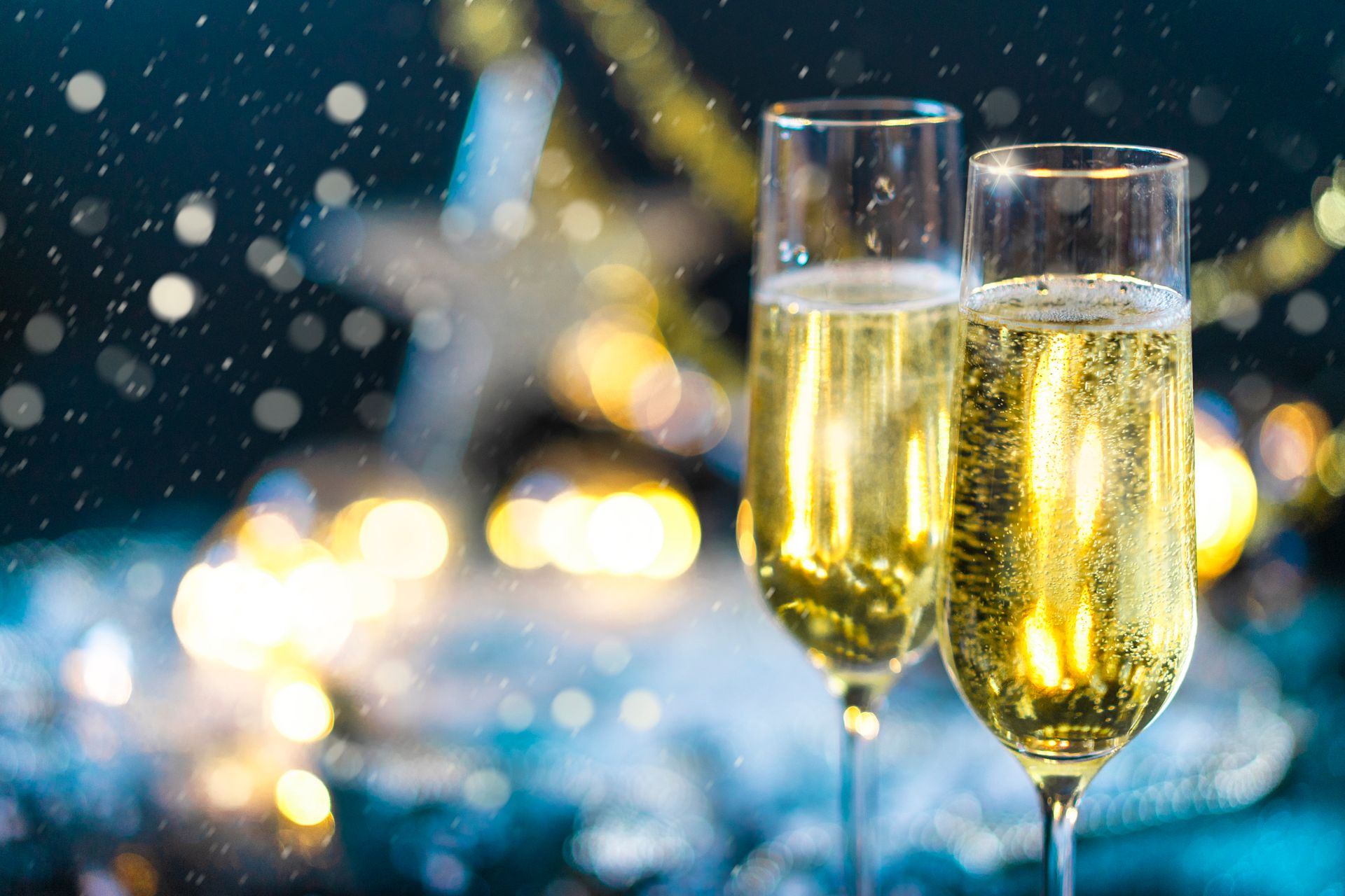 Close-up of two champagne flutes with bubbles, ideal for festive celebrations.