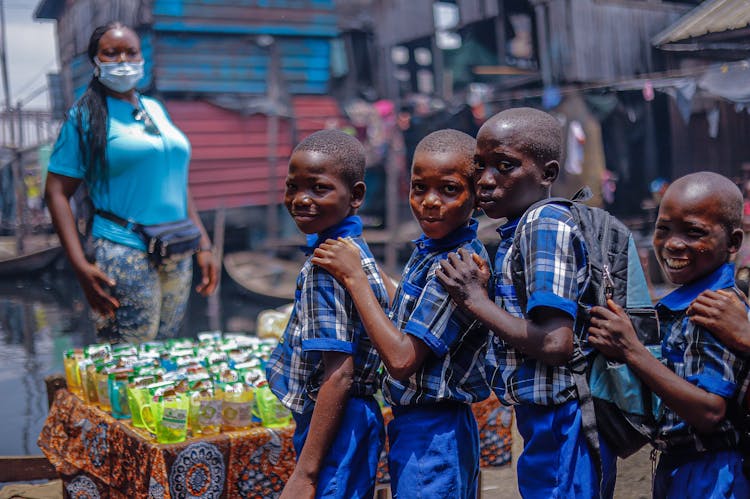 Students Lined Up Beside A Table