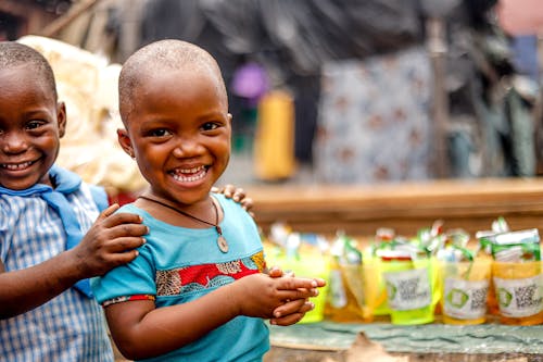 A Boy Holding a Girl's Shoulders