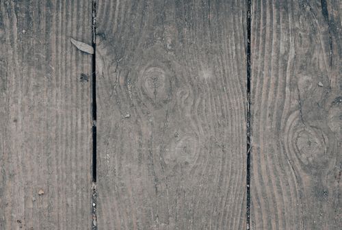 Free Rustic wooden texture with grains and knots, ideal for backgrounds and design projects. Stock Photo