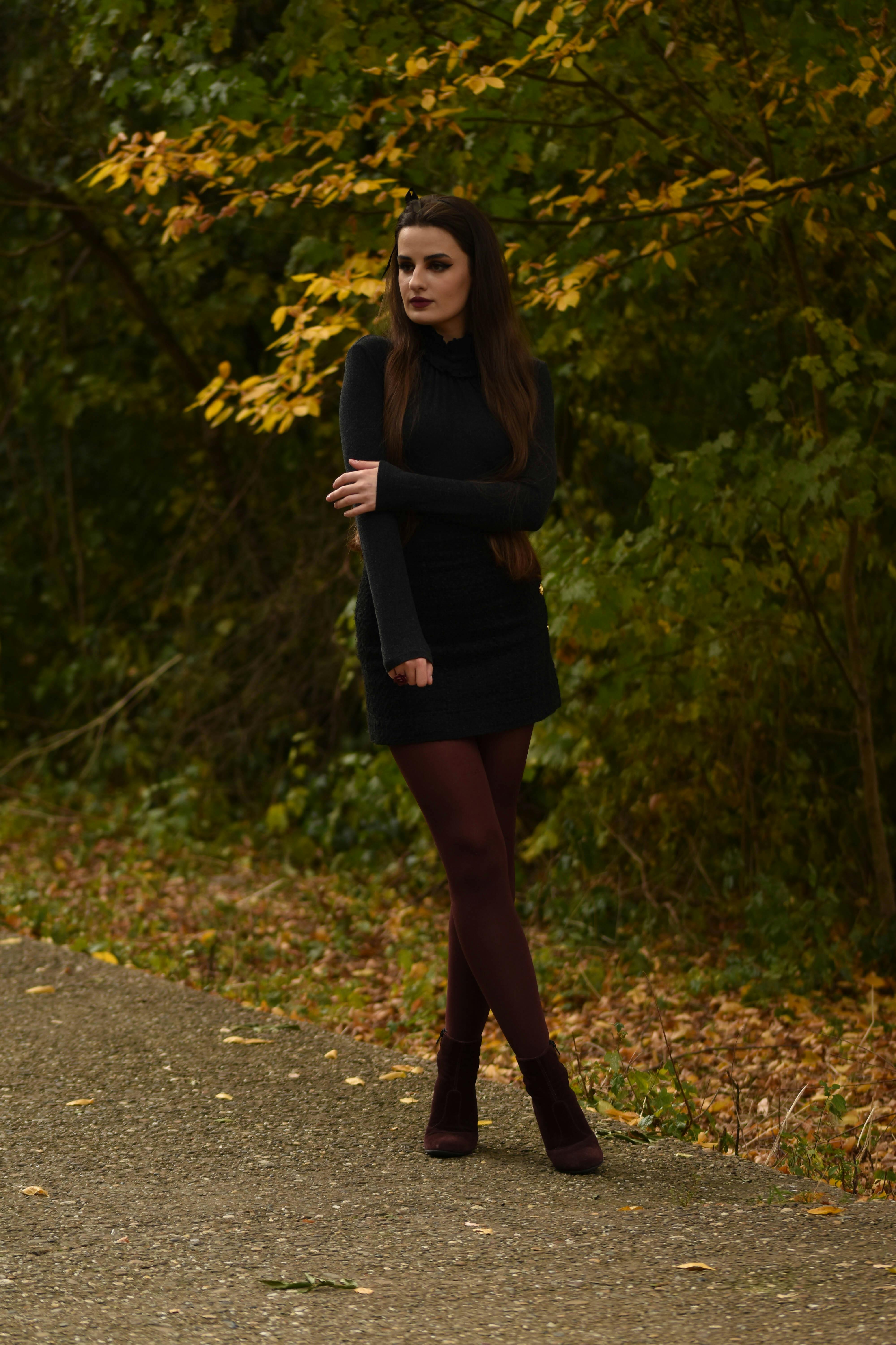 A Lovely You East Indian Woman Standing In Profile In Black Tights