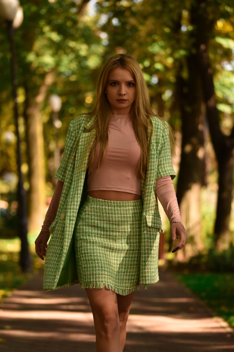 Woman In Green Plaid Suit Walking In The Park