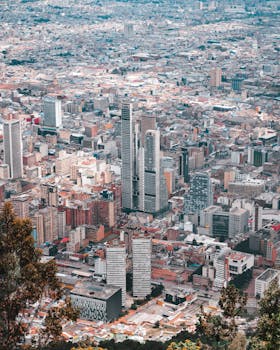 Expansive aerial view showcasing Bogotá's bustling cityscape and high-rises.