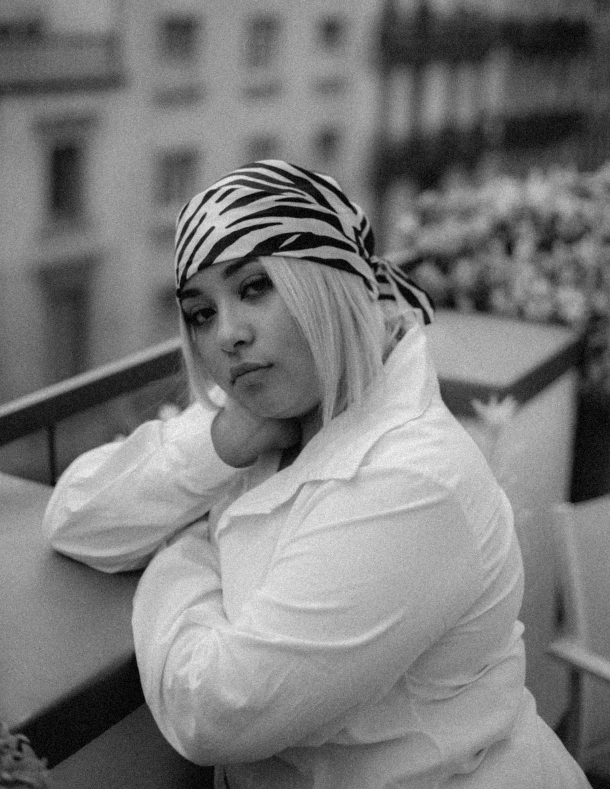 bandana hairstyles 2026 woman with tiger print bandana editorial black and white fashion
