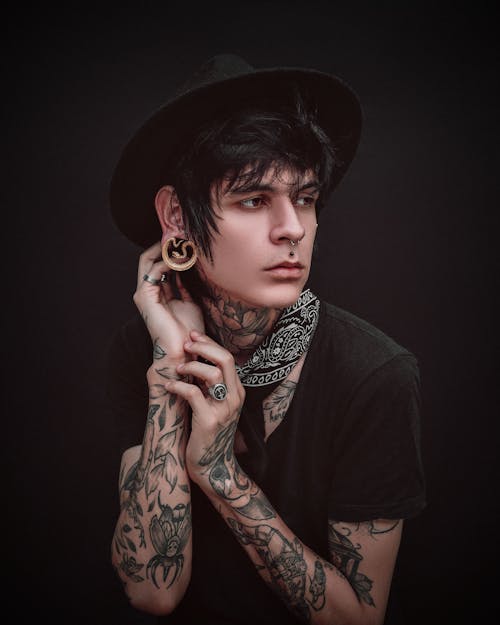 Free Young man with tattoos and piercing  Stock Photo