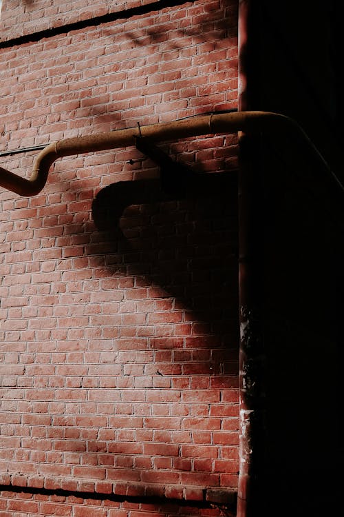 Brick Wall with Pipes