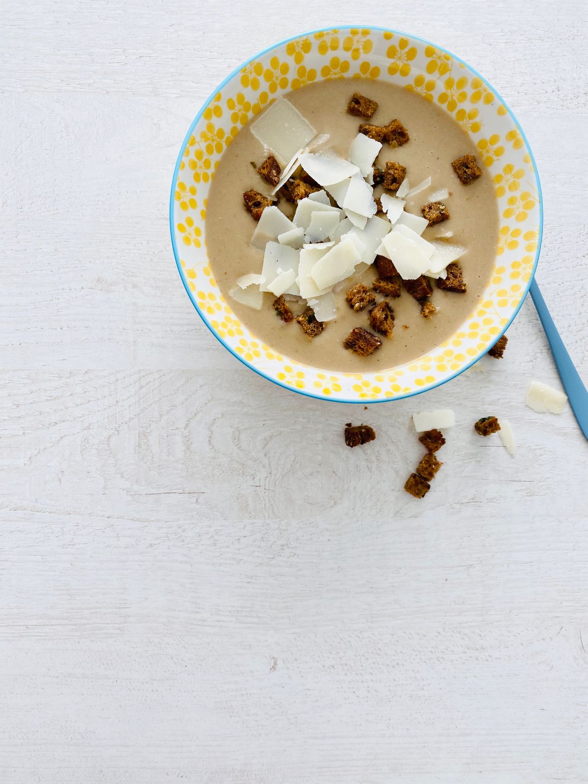 Creamy soup in a white ceramic bowl for sweet corn chowder