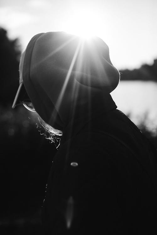 Free Grayscale Photo of Person in Hoodie Stock Photo