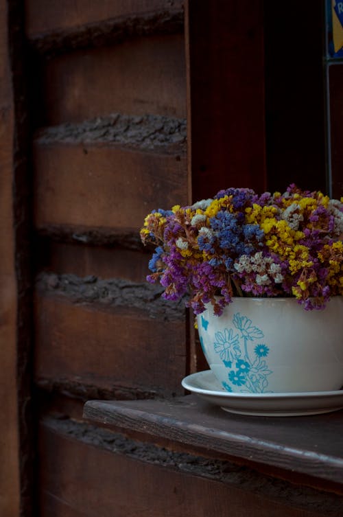 Close-Up Shot of Flowers on a Ceramic Vase