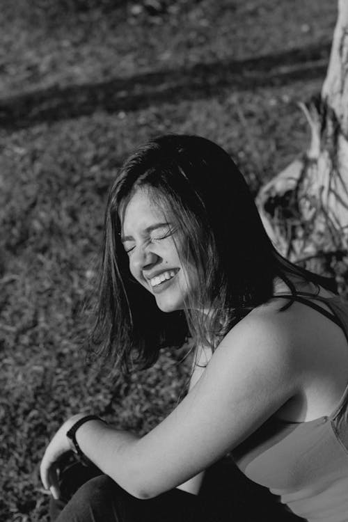 Black and White Photo of a Woman Smiling