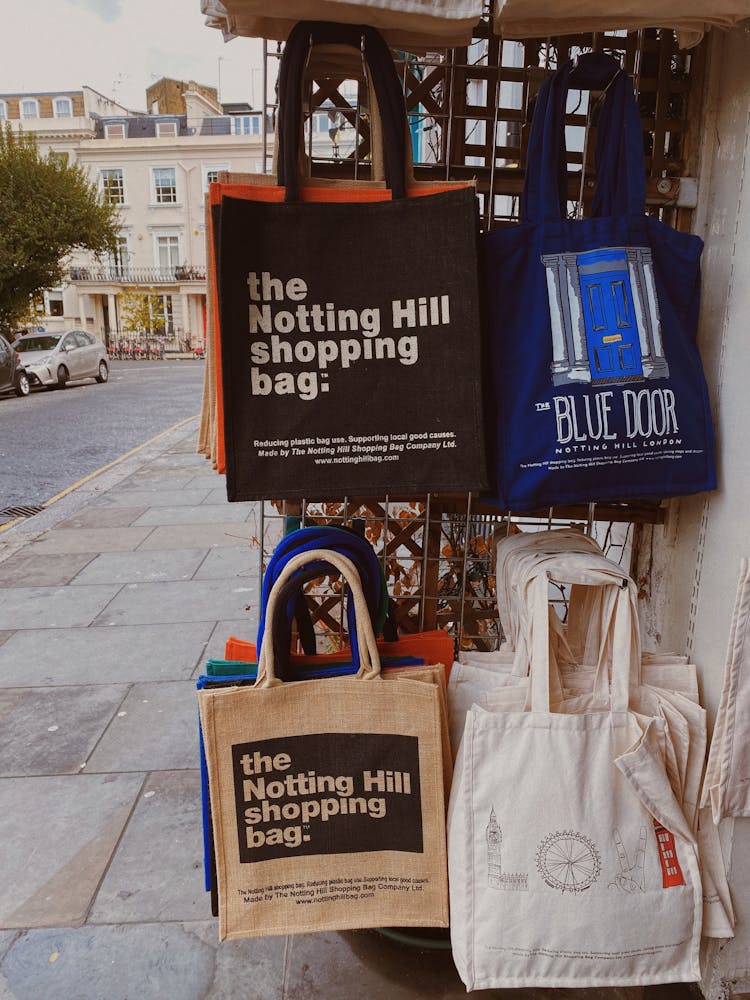 Tote Bags Hanged On A Metal Rack