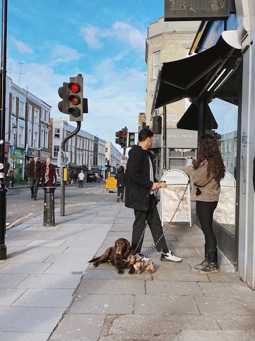 People Talking on a Sidewalk 