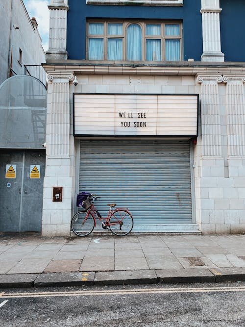Bike standing next to closed store