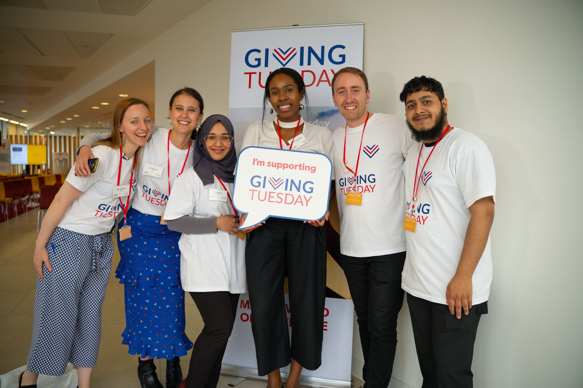 A group of activists posing to a picture at an event