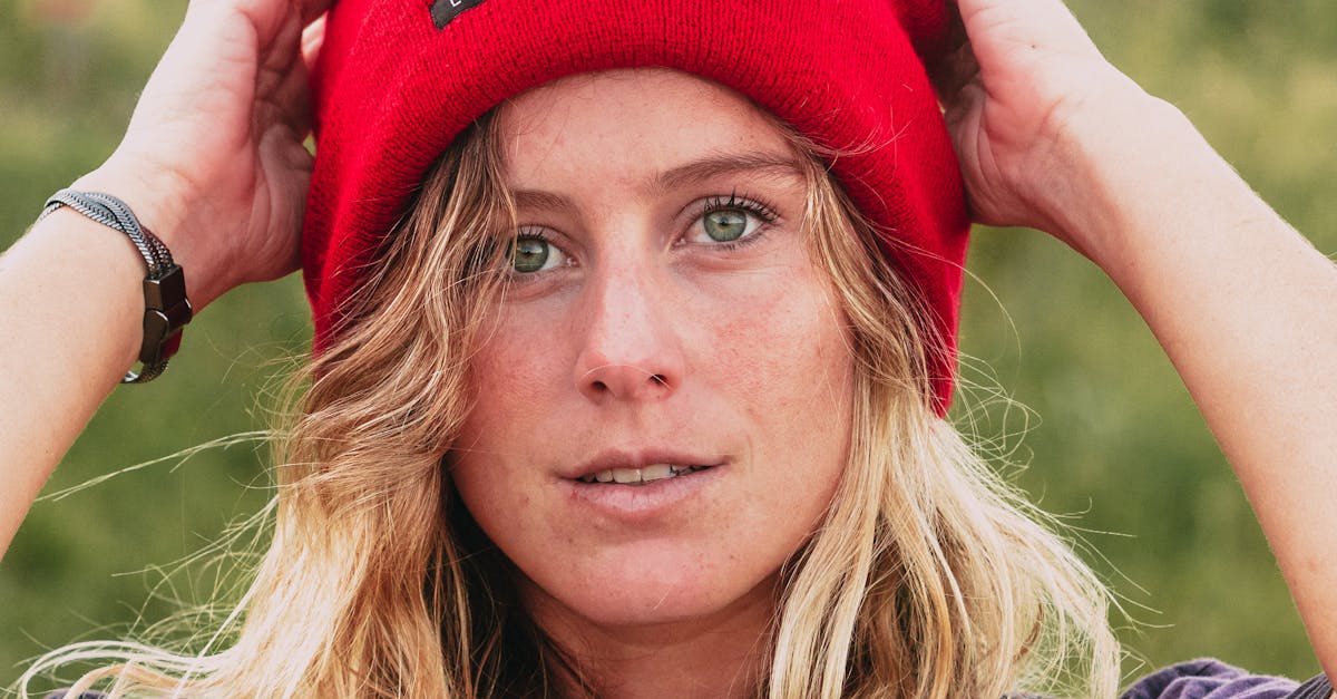 Headshot of a Pretty Woman Wearing a Red Knitted Cap · Free Stock Photo