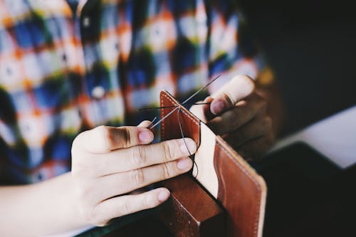 Free Person Knitting Brown Leather Textile Stock Photo