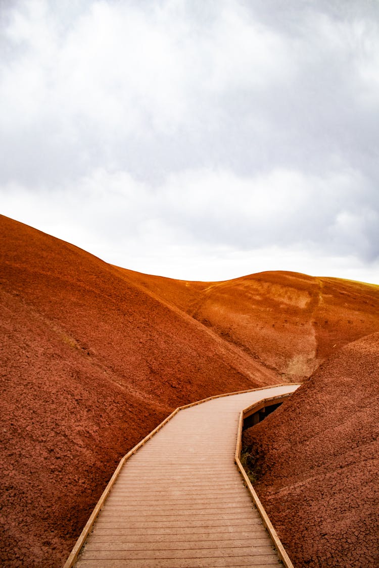 Wooden Footbridge Running Through Desert Red Sand Area