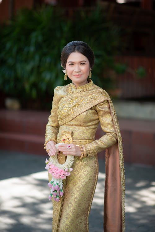 A Woman in Gold Traditional Dress 