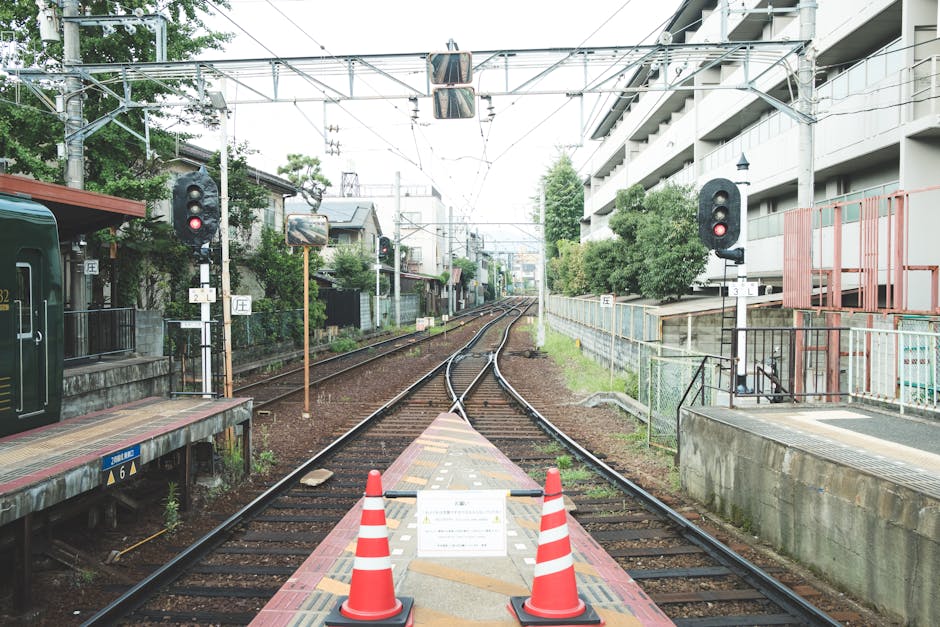 NordPass vs Bitwarden: Autofill Sync Showdown View of an empty railway crossing with traffic cones in a suburban area in Japan.