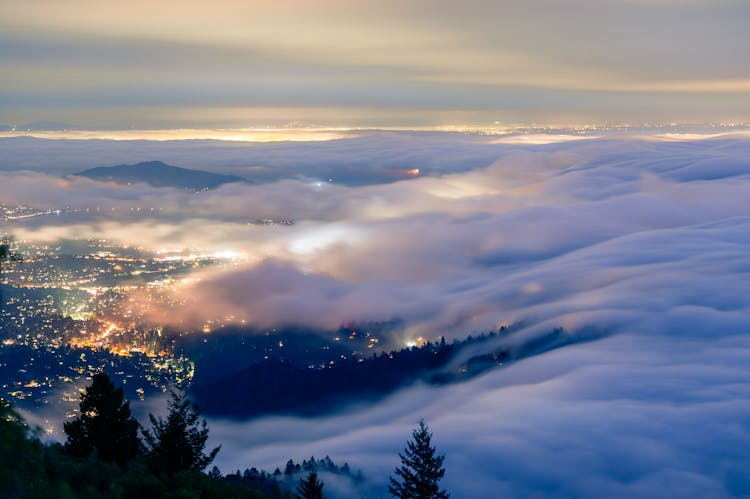 Aerial View Of City In Clouds At Night