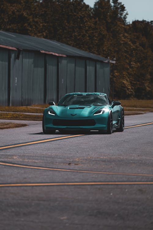 Free Green Sport Car on Road Stock Photo