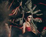 Woman in makeup among statues