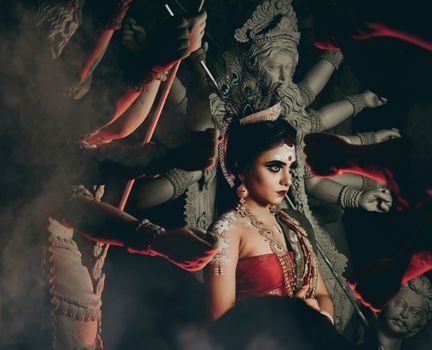 Woman in makeup among statues