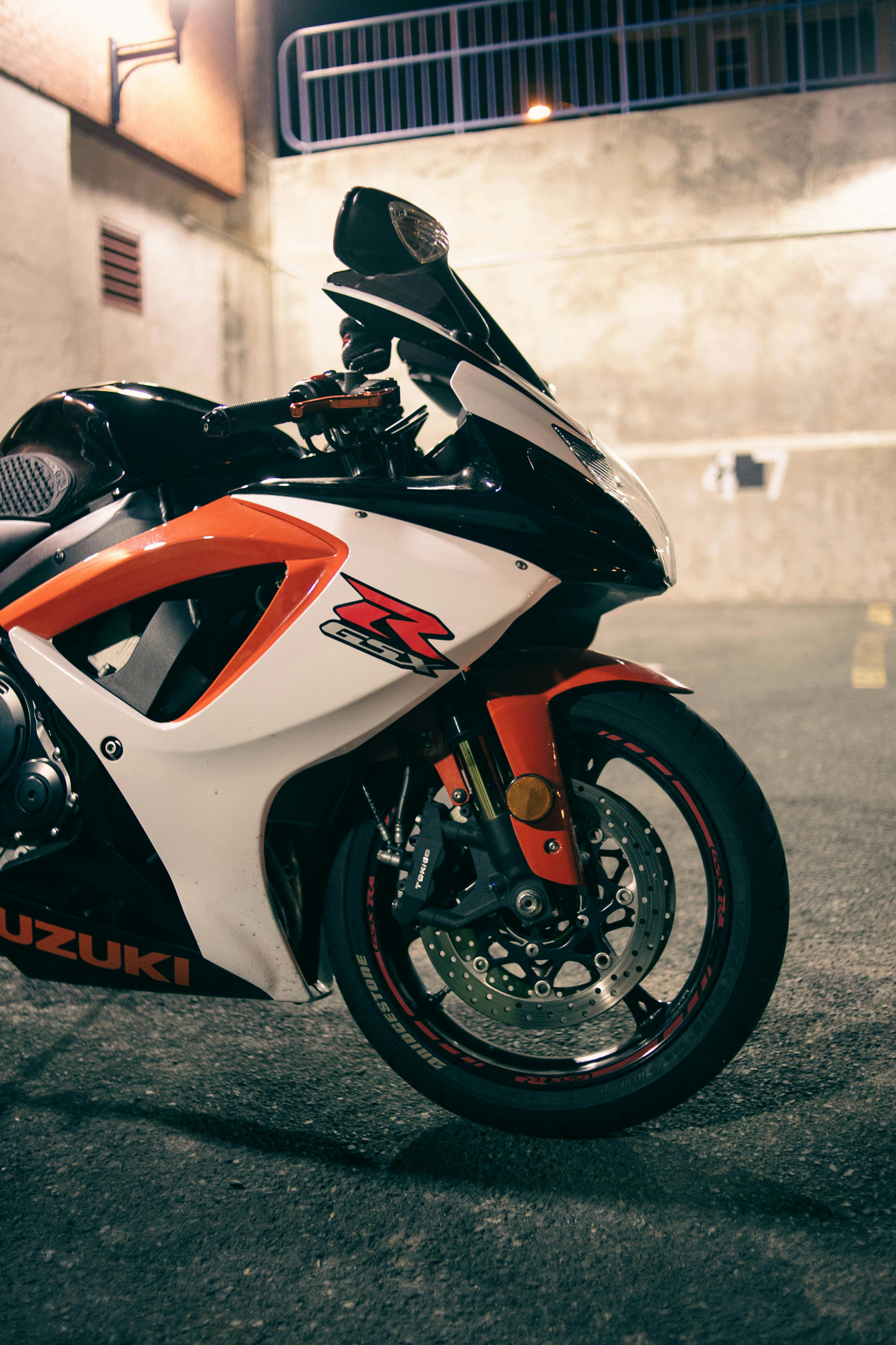 A Black Motorbike Parked Near a Street Gutter · Free Stock Photo A Black Motorbike Parked Near a Street Gutter · Free Stock Photo