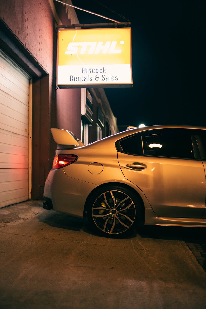 Photo of a Car Near a Store Signage