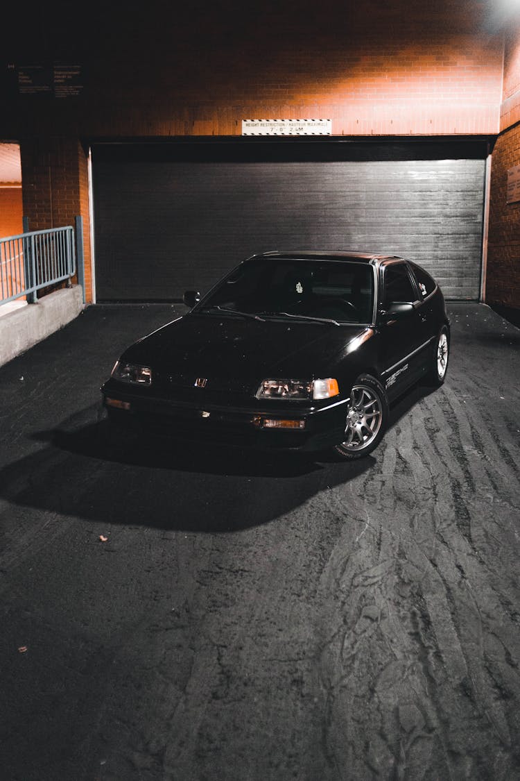 Black Car In Front Of Garage