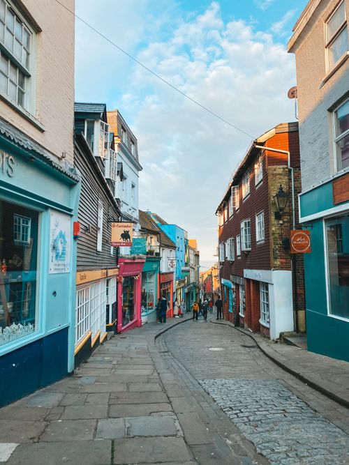 Free A vibrant alleyway with colorful buildings in a historic town, perfect for travel and architecture enthusiasts. Stock Photo