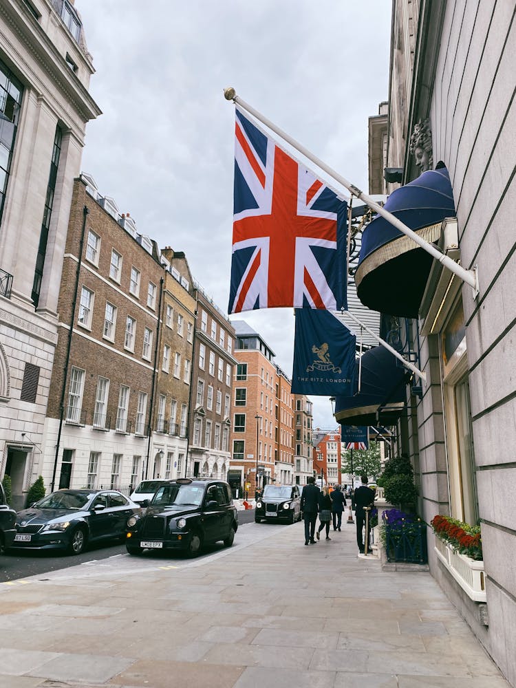 Flags Hanging On Concrete Building