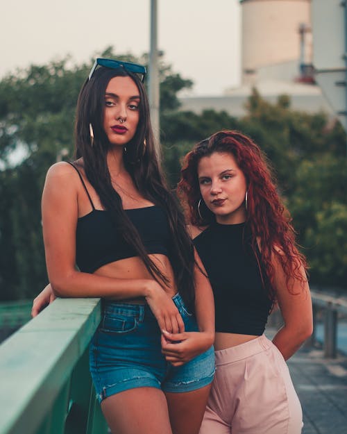 Free Two Female Models Posing in the Street Stock Photo