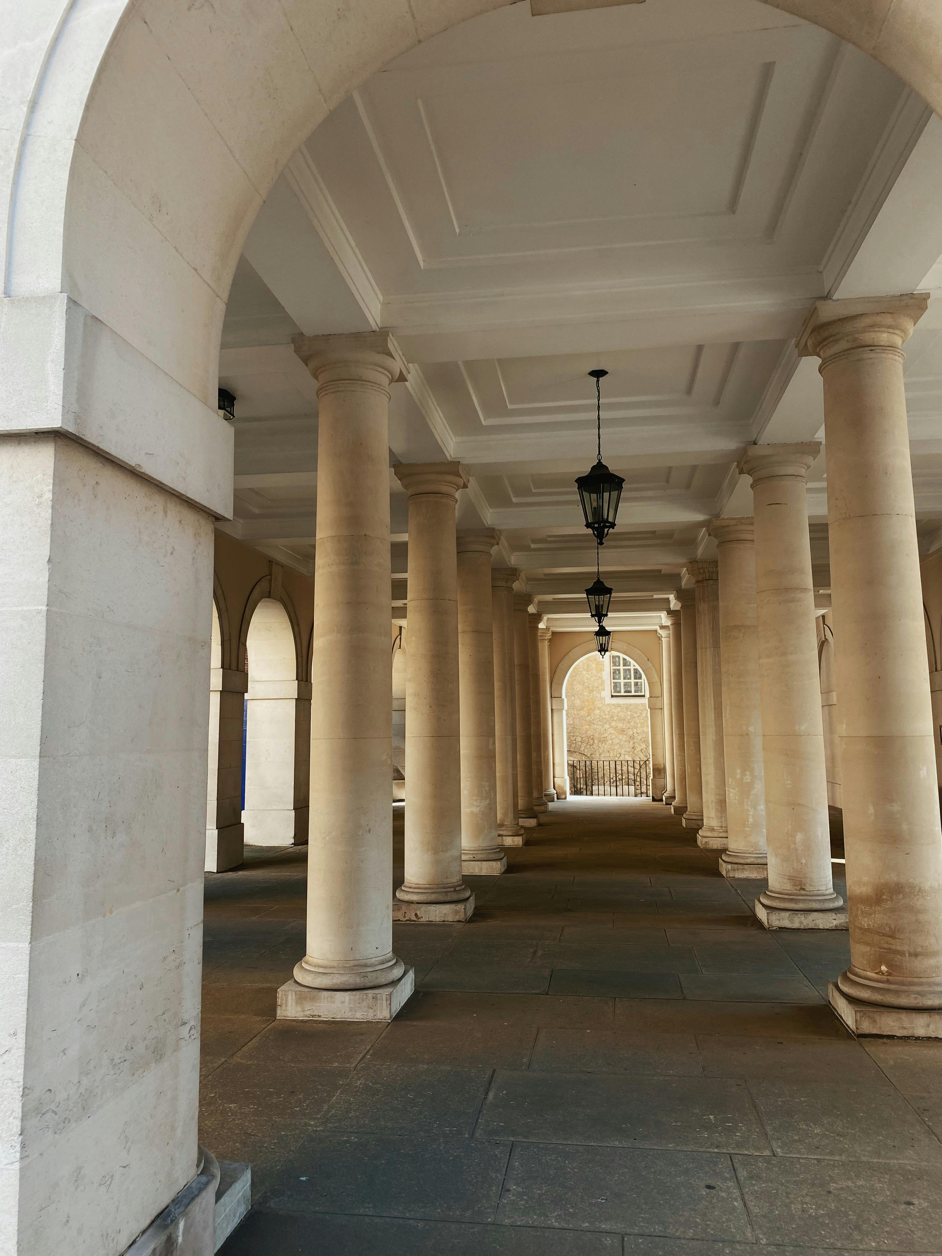 Classic stone columns form an elegant covered passageway in Greater London, United Kingdom.