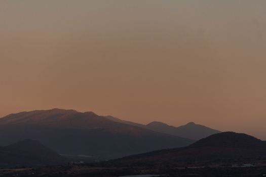 Serene landscape of mountains at sunset in Jacona de Plancarte, Mexico.