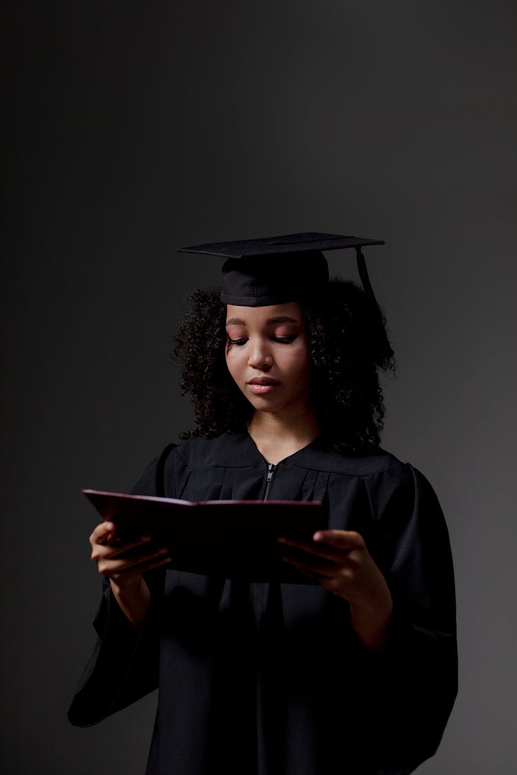 Disappointed Graduate Student Holding Diploma