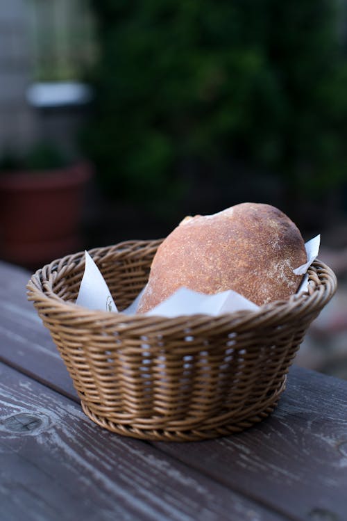 Brown Bread in a Wicker Basket on Gray Wooden Table