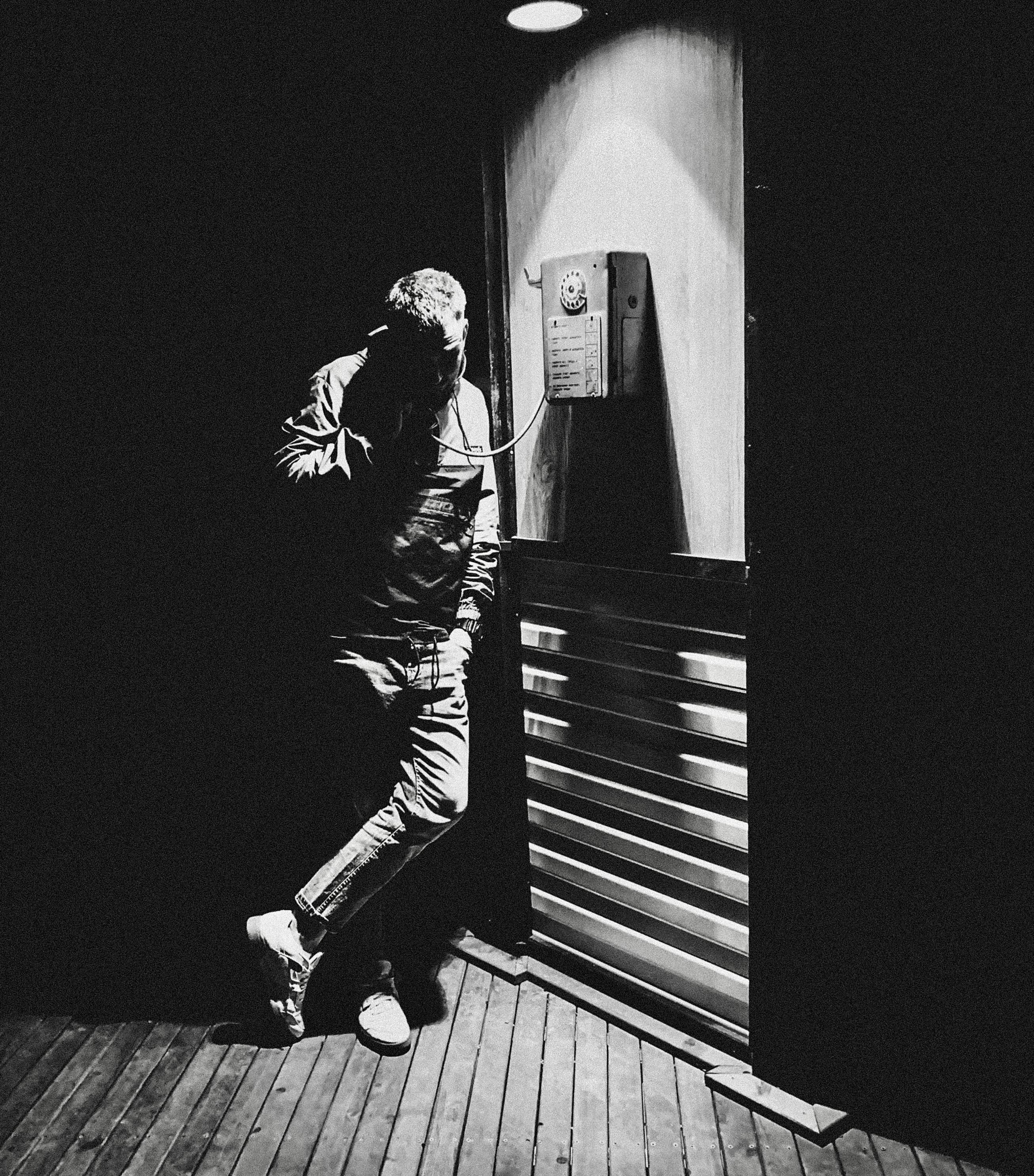 Man Using a Payphone · Free Stock Photo