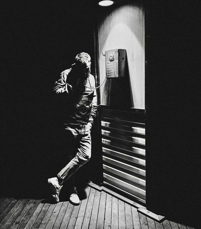 Man Using a Payphone · Free Stock Photo